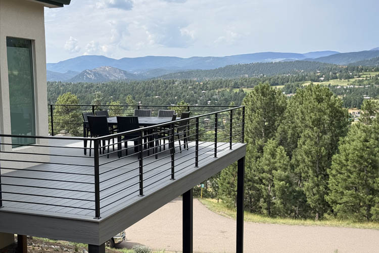 Evergreen-CO custom built Trex composite deck with steel framing - iron railing