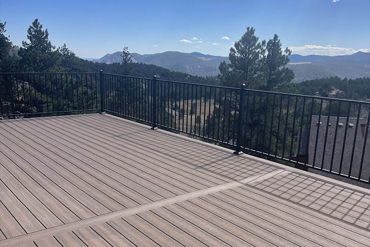 Mountain View from the new Trex Deck with Roof and metal railing built with steel framing in Golden, Colorado
