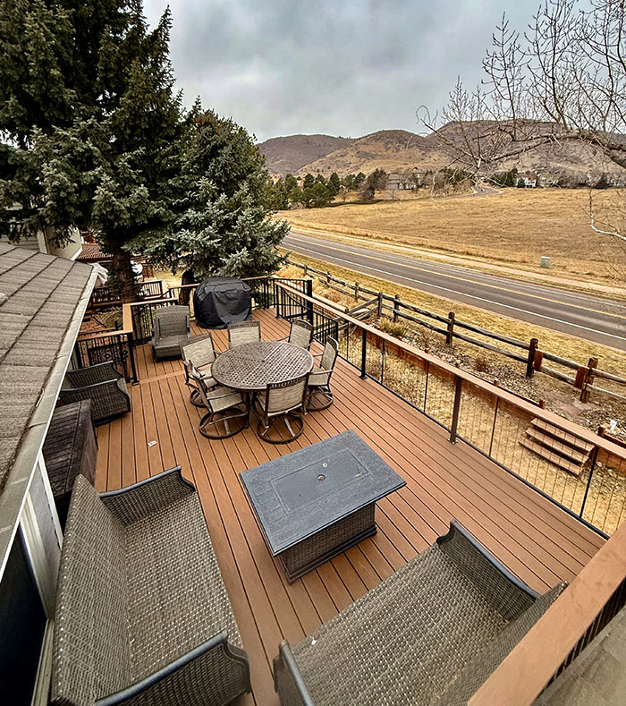 Littleton-CO composite Trex deck with metal railing and spiral-staircase