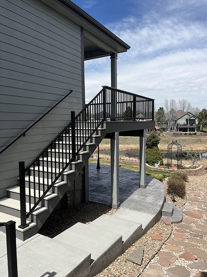 Trex deck with black aluminum railing and steel-framing view of stairs