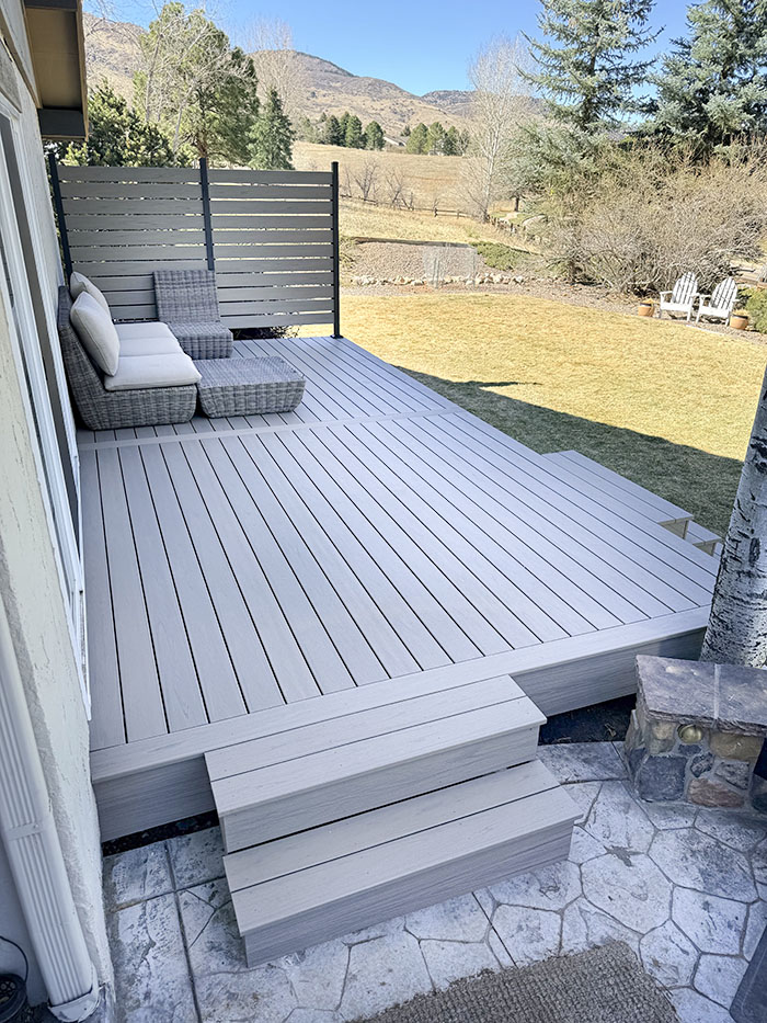 Littleton, Colorado custom Trex deck with privacy fence and steel-framing for outdoor living in the backyard